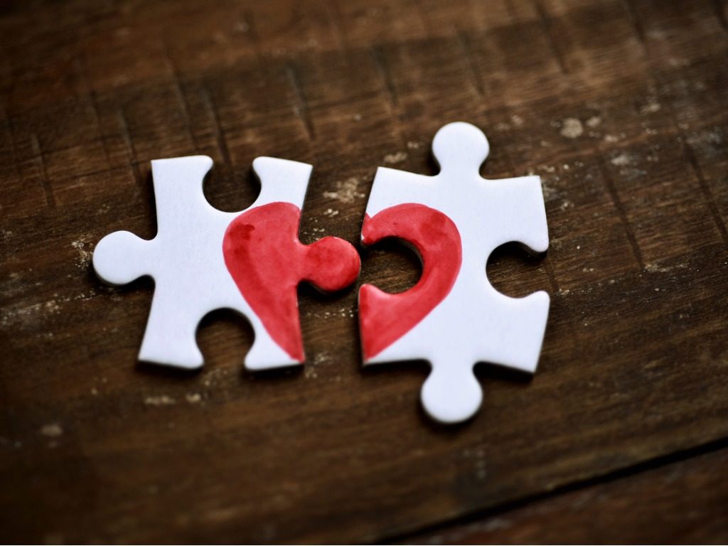 Broken Heart On Two Puzzle Pieces Separated To Represent Relationship Problems